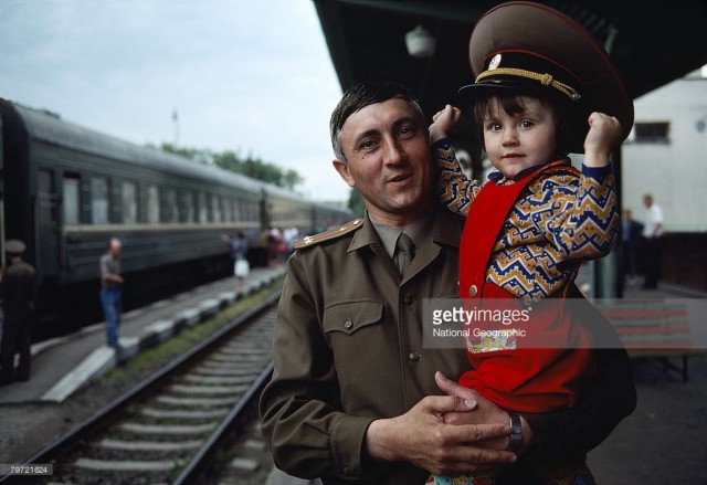 A Soviet colonel waits to bid Farwell to men leaving Czechoslovakia, Milovice, Czechoslovakia (March 01, 1990).jpg